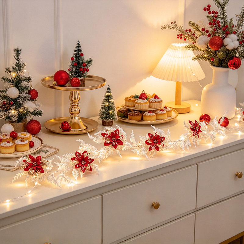 赤と金のポインセチアの花が飾られた白いクリスマスガーランド。 - Led Fairy String Lights のレビューと価格